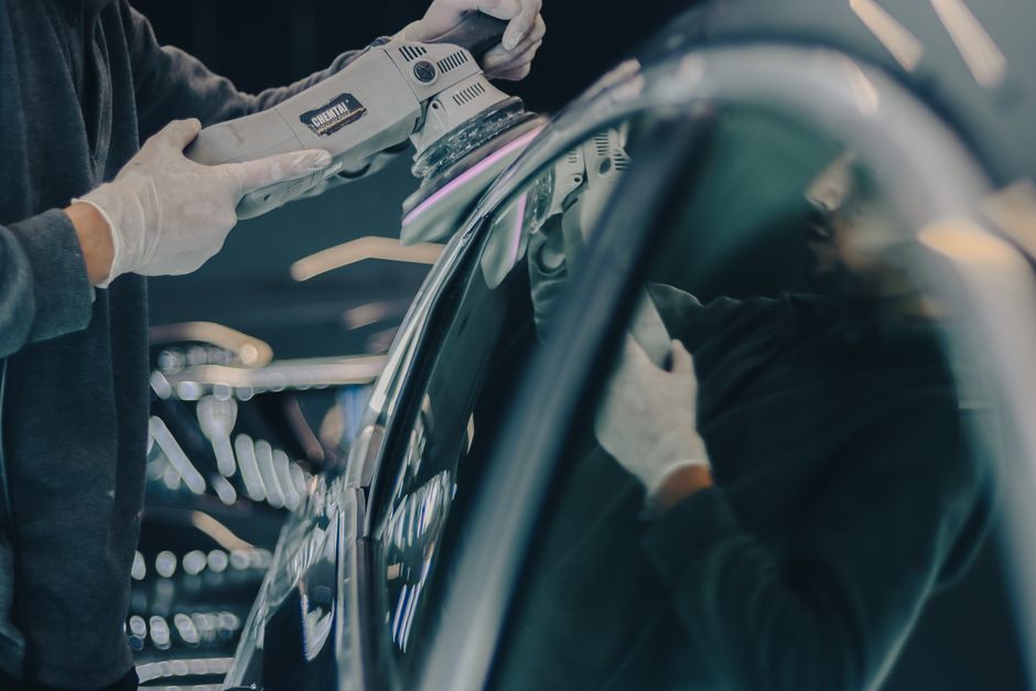 A dedicated auto detailing professional at work